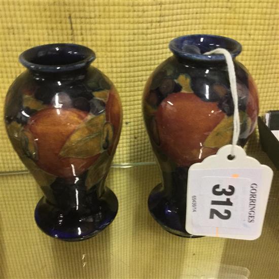 A pair of William Moorcroft miniature pomegranate baluster vases, c.1920, 9.7cm and 10cm